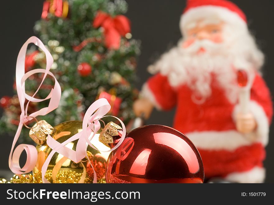 Santa with christmas decoration on the christmas tree background. Santa with christmas decoration on the christmas tree background