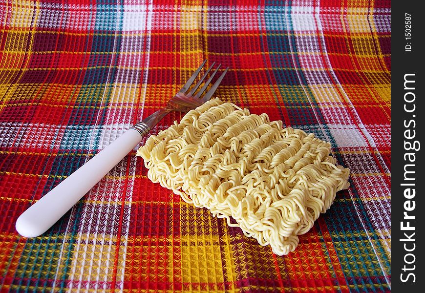 Noodles on a checkered fabric