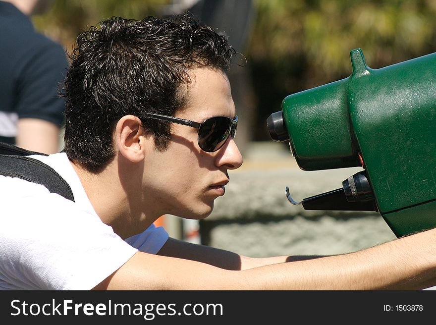 A young man  looking through a telescope II. A young man  looking through a telescope II