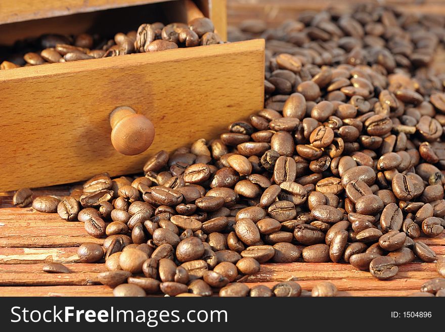 Coffee beans poured out on table