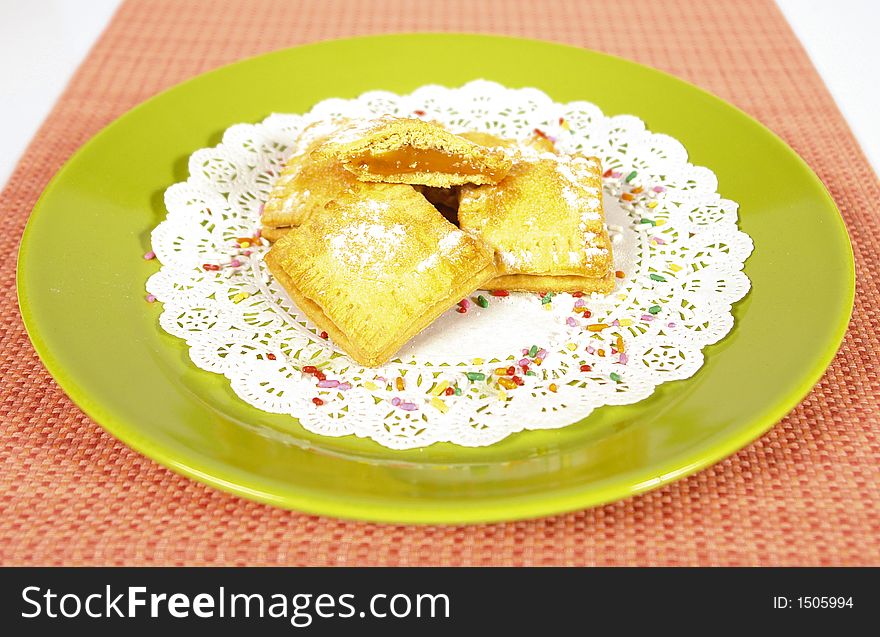 Marmelade filled baked sweet squares with powdered sugar on top. Marmelade filled baked sweet squares with powdered sugar on top