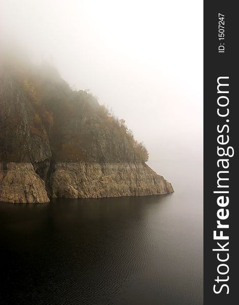 Lake coast in fog at Vidraru Dam - Romania, 166 m hight, 465 millions mc, build in 1966