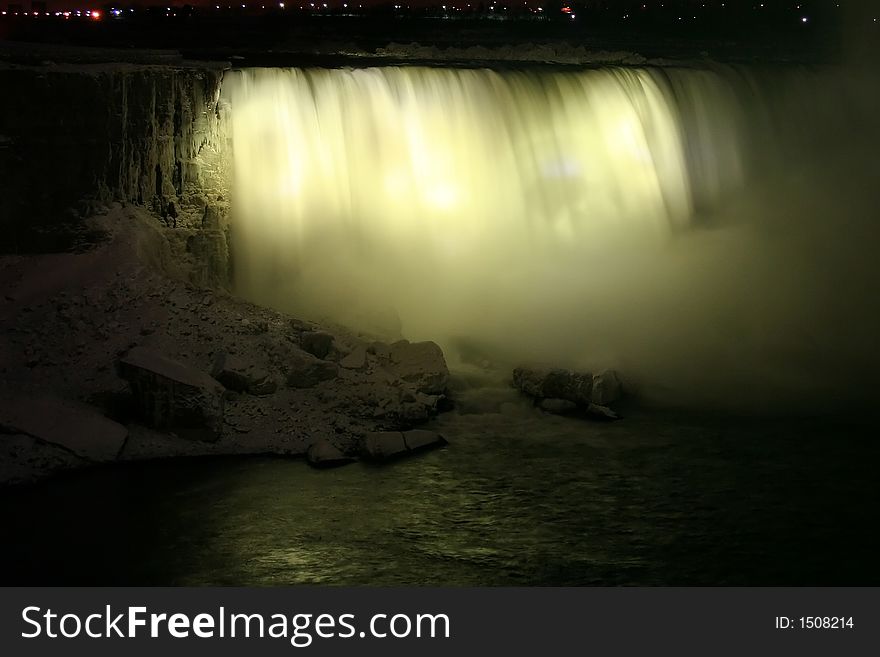 Niagara Horse Shoe Falls at Night with Yellow Lights
