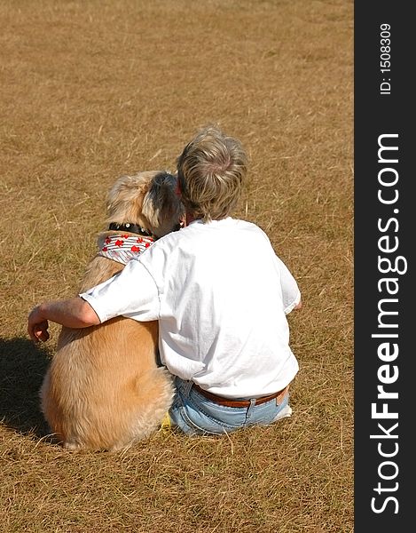 A dog and its owner express affection for one another. A dog and its owner express affection for one another