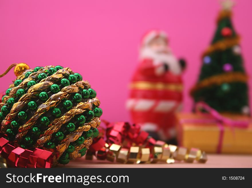 Christmas Ornament With Santa and Christmas Tree. Shallow DOF. Ornament has a big string of glue on it.