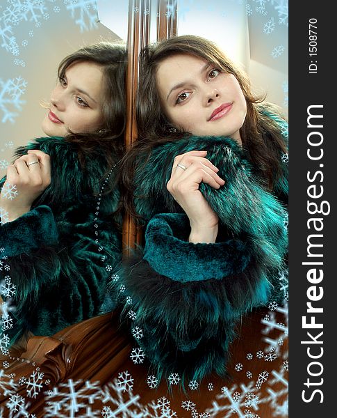 Lovely young woman in furcoat