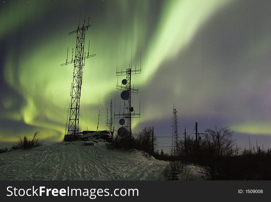 Scientific antennas under the night sky with aurora borealis. Scientific antennas under the night sky with aurora borealis