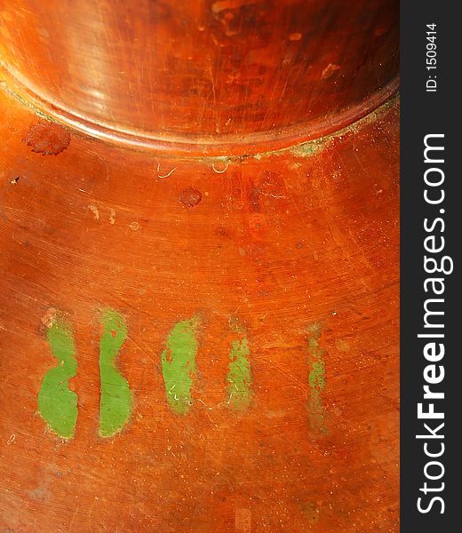 Brown copper destilation tank number label detail. Macro. Brown copper destilation tank number label detail. Macro