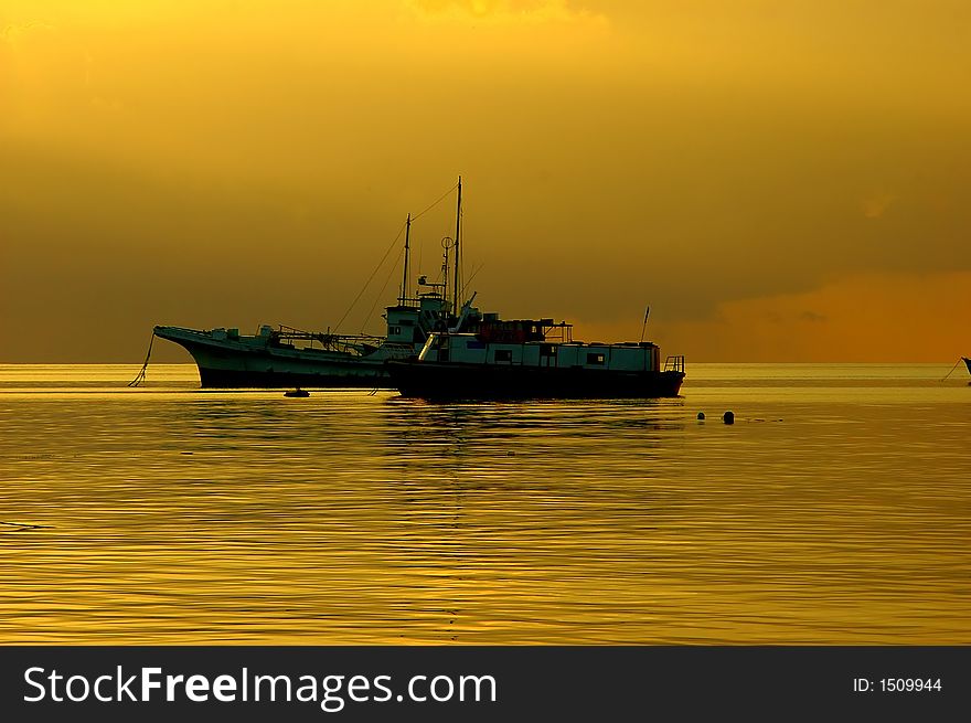 Boats anchored near K.Thulusdhoo of Maldives at sunset. Boats anchored near K.Thulusdhoo of Maldives at sunset.