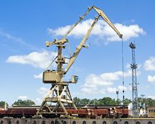 Crane At Loading Dock Over Blye Sky Stock Photo Crane At Loading Dock Over Blye Sky Stock Photo
