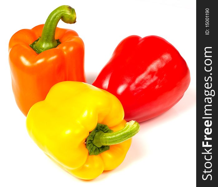 Red orange and yellow pepper on white background. Red orange and yellow pepper on white background