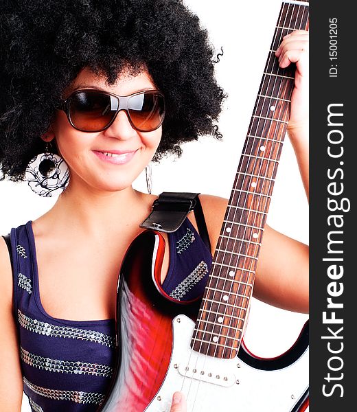 Young guitarist girl holding guitar isolated over white background