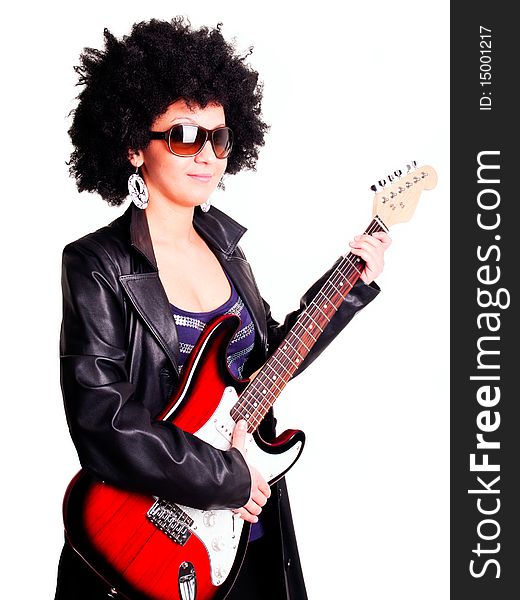 Young guitarist girl holding guitar isolated over white