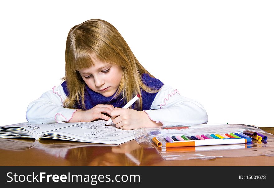 Cute young girl drawing with markers. clipping path