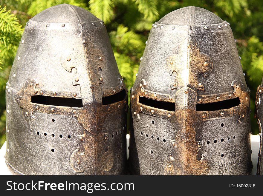 A close up of a medieval knight helmets.