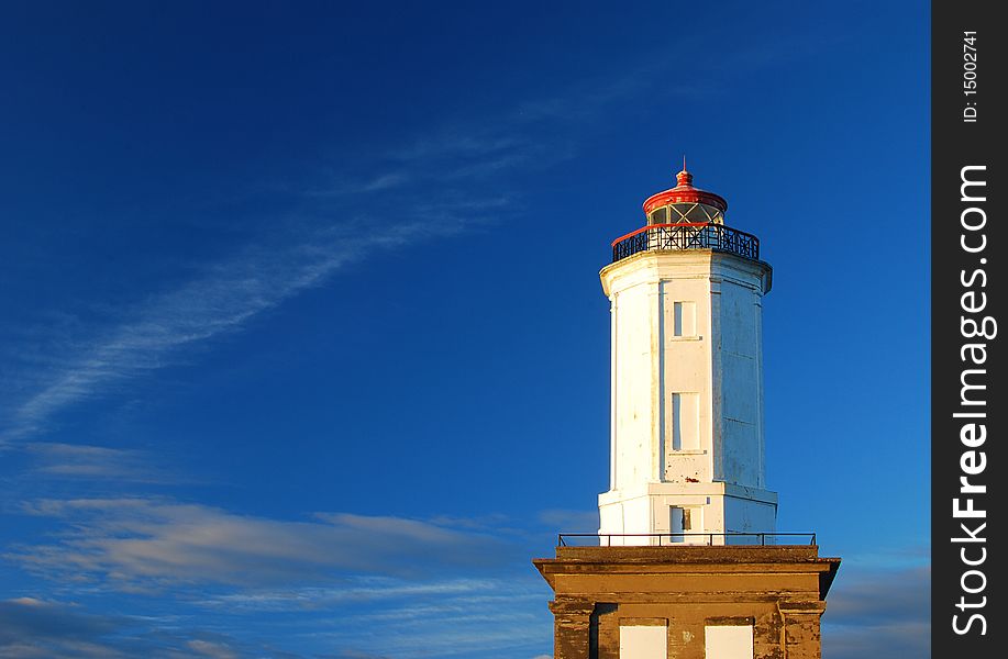 Regal Lighthouse Looking Out into a Vast Blue Sky. Regal Lighthouse Looking Out into a Vast Blue Sky