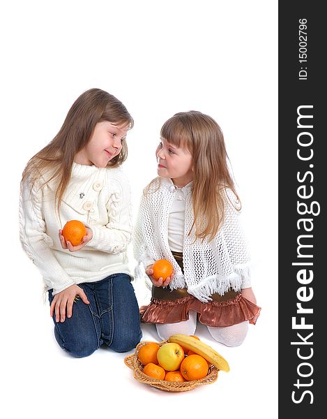 The little girls with fruits on white