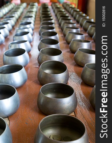Sacrifice Bowls At Buddhist Temple In Thailand.
