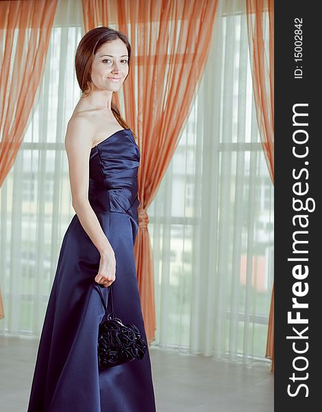 Romantic young lady posing in beautiful dress. Romantic young lady posing in beautiful dress