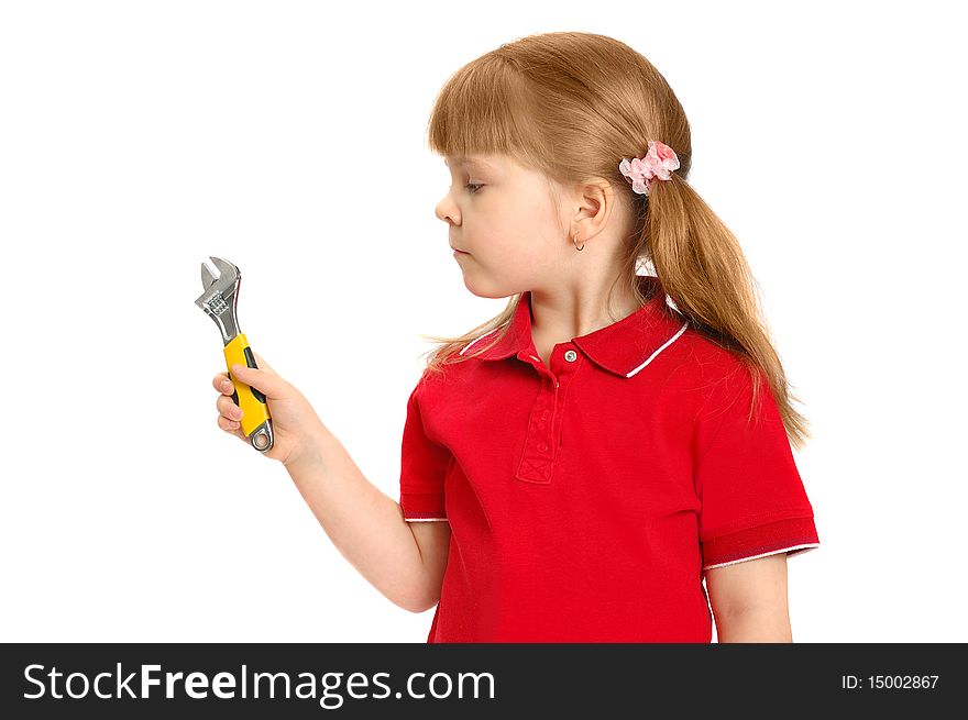 Little girl with a wrench on the white