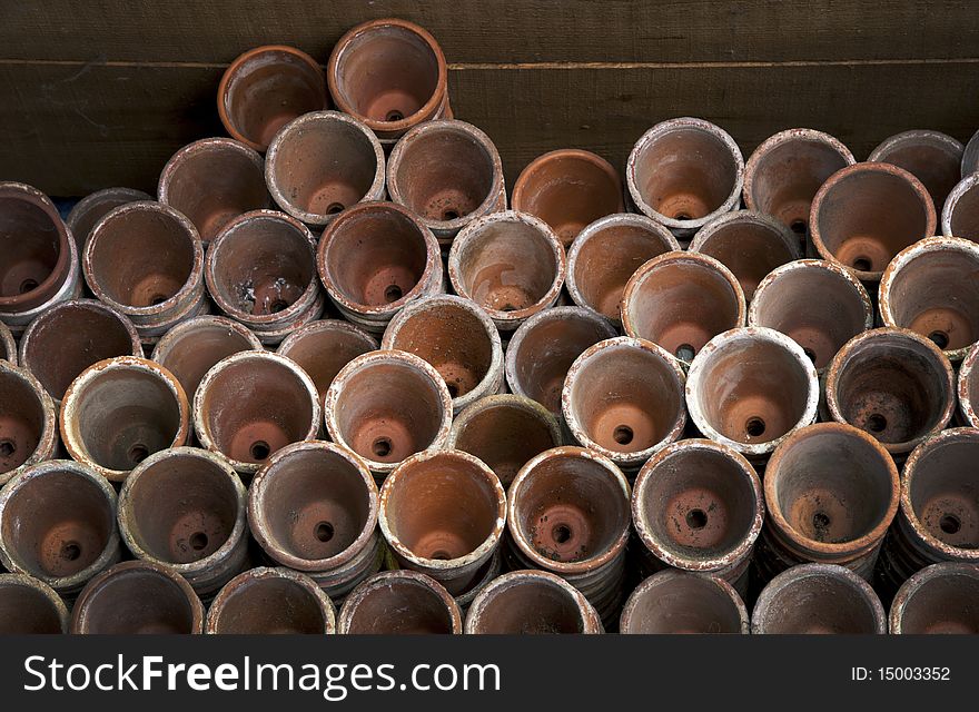 Old Victorian Clay Plant Pots Stacked In A Potting Shed. Old Victorian Clay Plant Pots Stacked In A Potting Shed