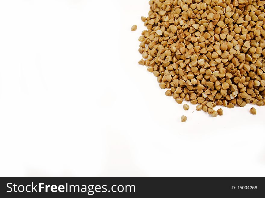Sprinkled buckwheat isolated on a white background