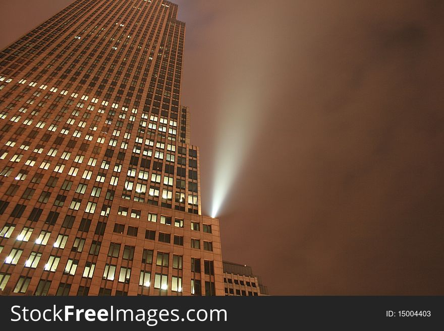 A high rise building on a foggy night. A high rise building on a foggy night