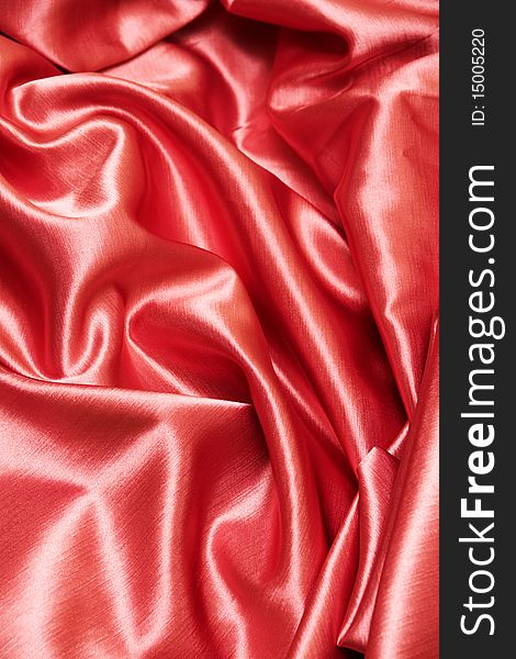 A red satin background or texture