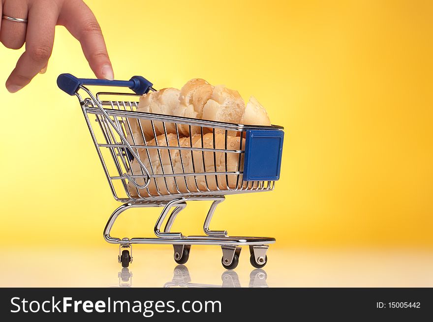 Metal shopping trolley filled with bread