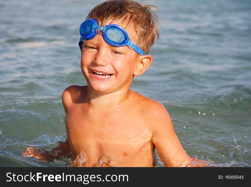 Portrait of happy boy in water