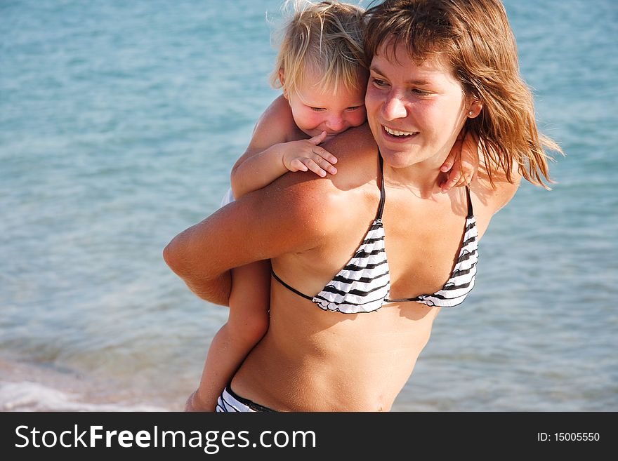 Happy Mother And Kid On Sea