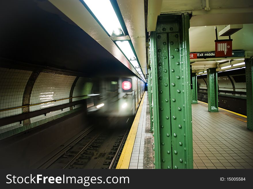 Subway car pulling into station in Brooklyn, New York.