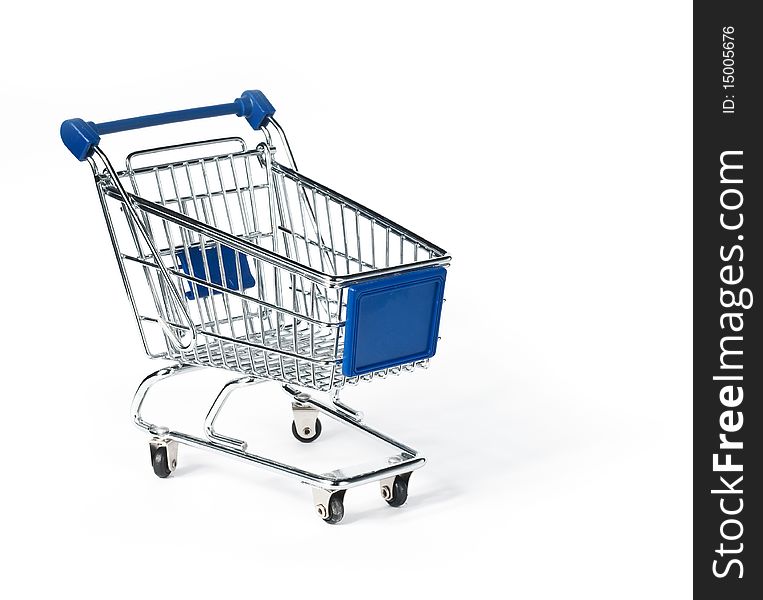 Isolated shopping trolley on yellow