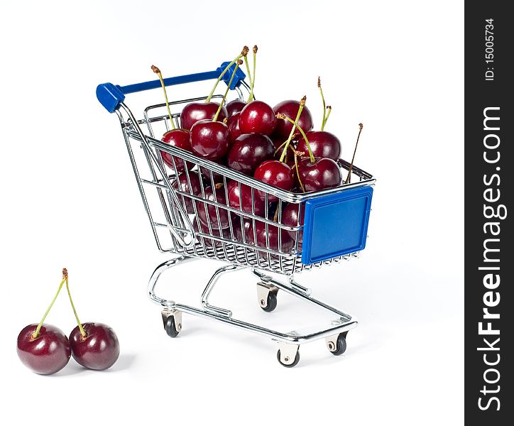 Metal shopping trolley filled with cherry