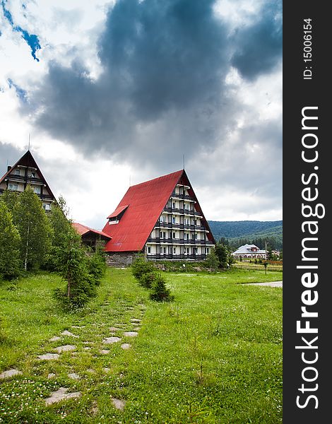 Beautiful mountain hut in a cloudy day in the Carpathians, Romania. Beautiful mountain hut in a cloudy day in the Carpathians, Romania.