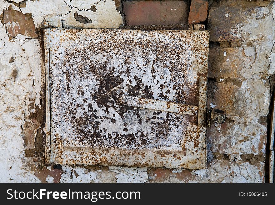 Closed door of the old furnace