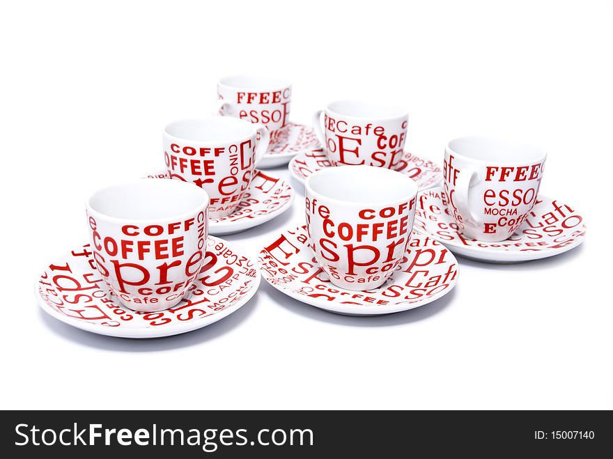 Coffee cups and saucers in white with red inscriptions on a white background