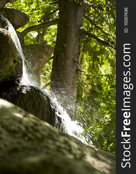 Close up view of the little waterfall in the forest