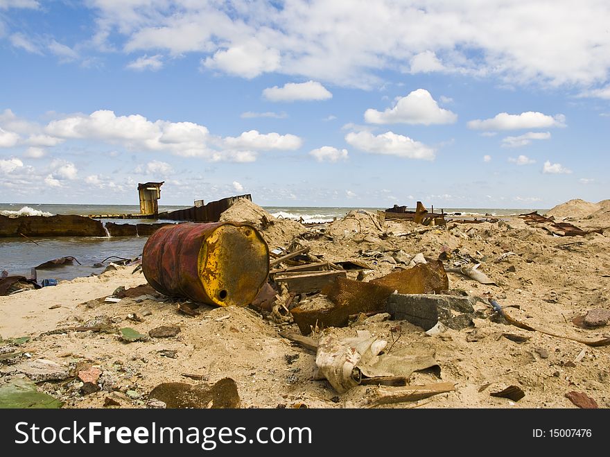 Fragments of old ships and metal debris washed up on shore. Fragments of old ships and metal debris washed up on shore