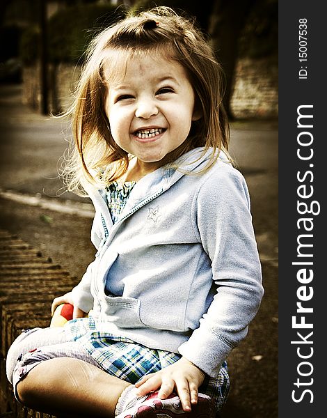 Little cute smiling girl in sepia tone. Little cute smiling girl in sepia tone