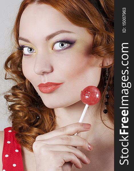 Woman holding sweet sugar candy closeup. Woman holding sweet sugar candy closeup.