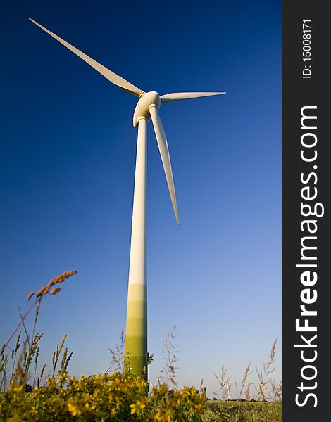 Windmills against a blue sky, alternative energy source