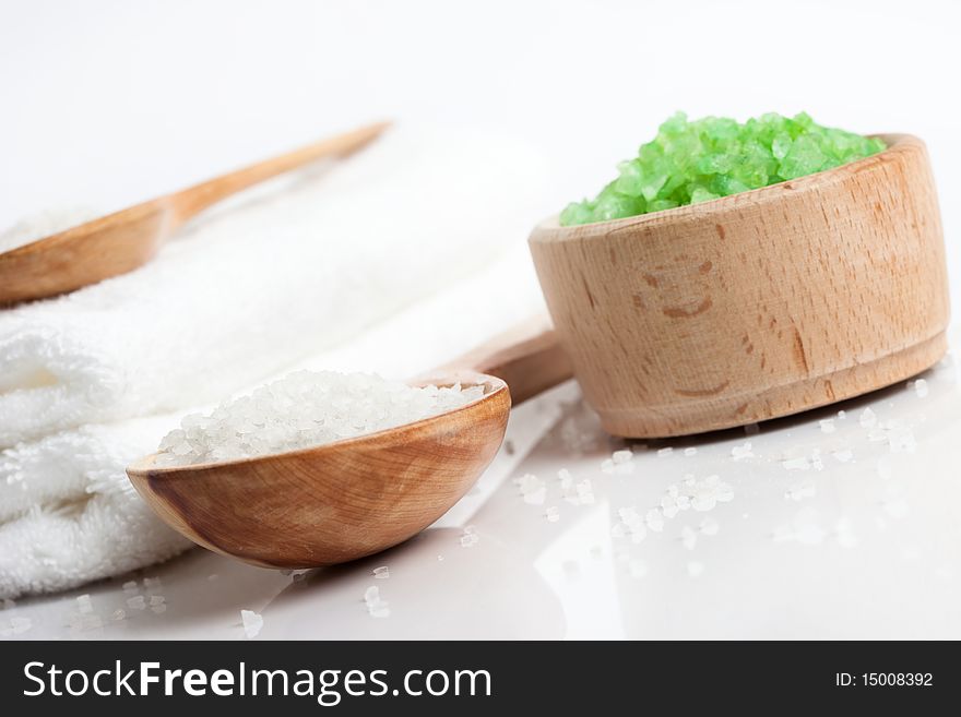 Spa essentials (bath salt in a spoon and towel)