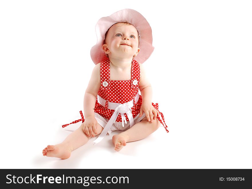 Little baby girl in red dress and hat