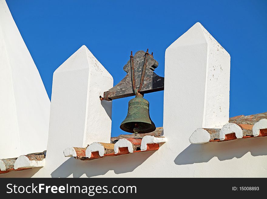 Closeup view of a bell of an old church in Algarve, Portugal