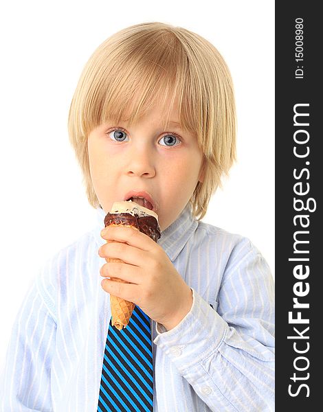 Little boy eating ice cream. Child isolated on white