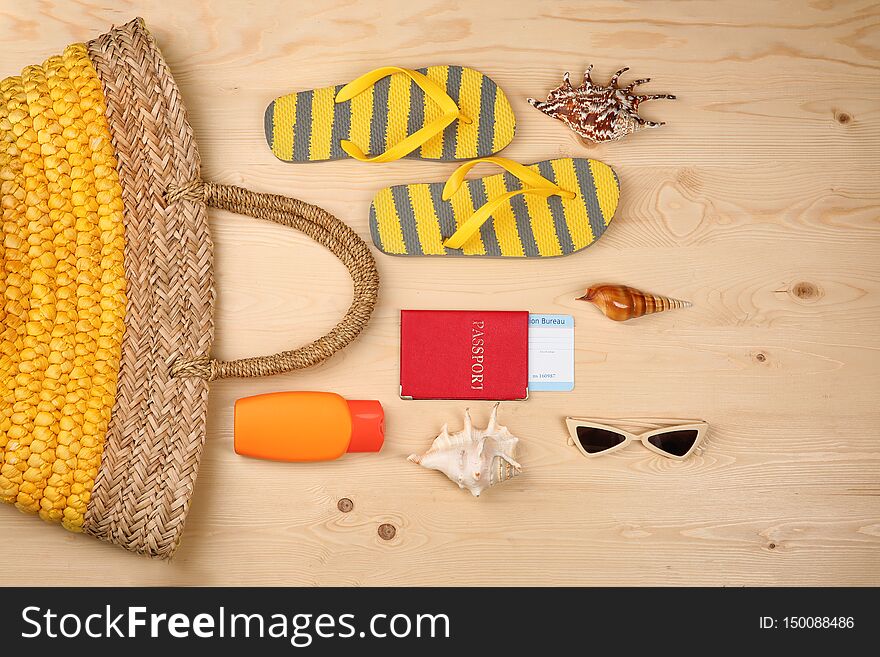 Composition with tourist s stuff on wooden background, top view