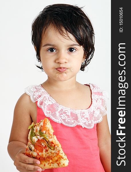 Sweet and pretty toddler posing for camera and eating pizza slice. Sweet and pretty toddler posing for camera and eating pizza slice