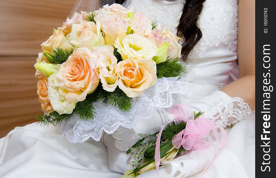 Lively wedding bride holding flowers