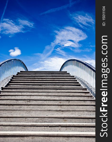 Wooden bridge with blue sky in the backround